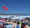 https://www.tp24.it/immagini_articoli/16-08-2019/1565974398-0-capitolo-spiaggia-vito-capo-giganteschi-palloni-rossi.jpg